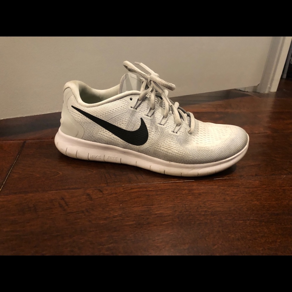 White Nike Free Run tennis shoes. Size 7